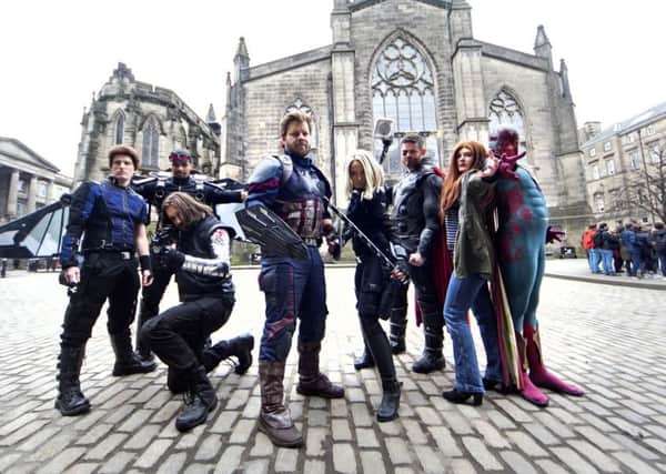 Avengers fans in costume around film locations - the characters outside St Giles