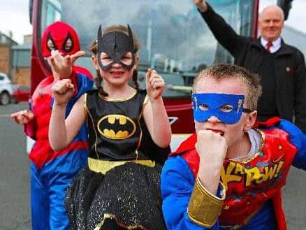 Esme Macfarlane, Lewis Macfarlane and Cameron Macfarlane dressed as their heroes with driver Michael Rigg