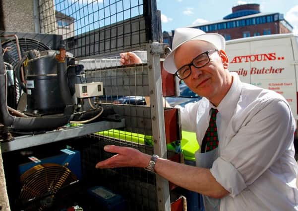 Keith Stewart, proprietor of Aytouns Family Butcher, Dalkeith, pictured with the compressors that are in question.