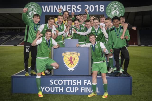 The Hibs players celebrate their win over Aberdeen at Hampden. Pic: John Devlin