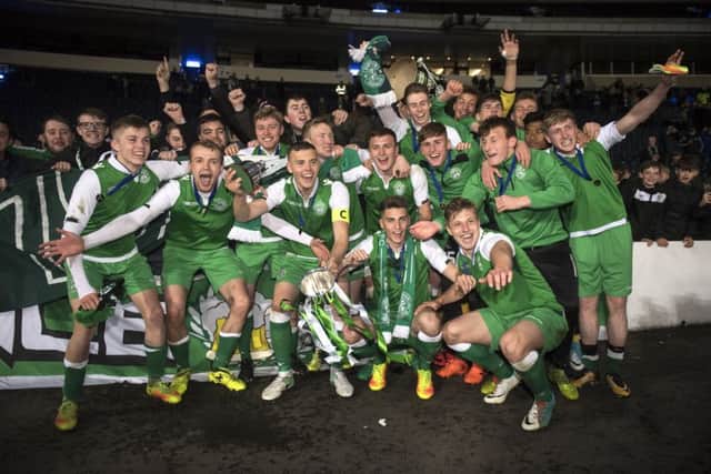 The Hibs squad celebrate their SFA Youth Cup win over Aberdeen. Pic: John Devlin