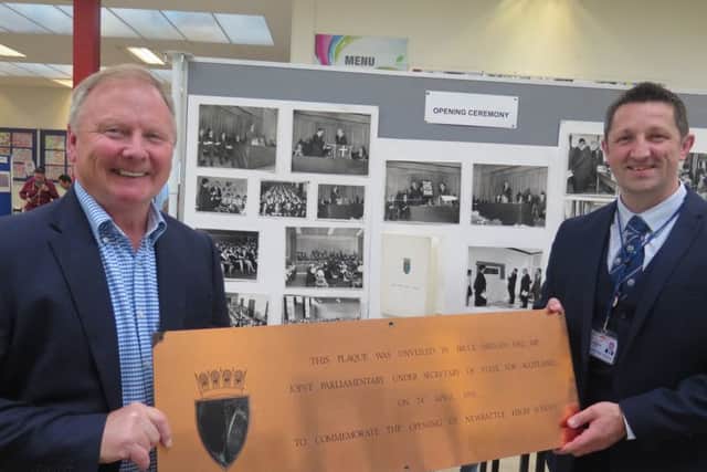 Newbattle High School exhibition - former head teacher Colin Taylor with the current head teacher, Gib McMillan. They are holding the official plaque to mark the unveiling of the school at the official opening in 1970 by Bruce Millan, the former Secretary of State for Scotland.