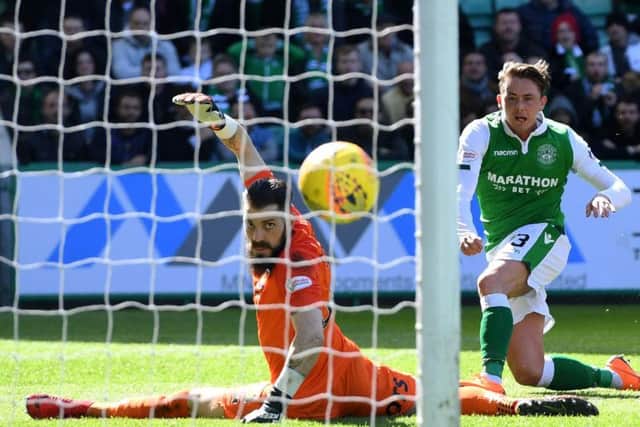 Scott Allan steers the ball beyond Kilmarnock goalkeeper Leo Fasan to give Hibs a 29th minutes lead at Easter Road