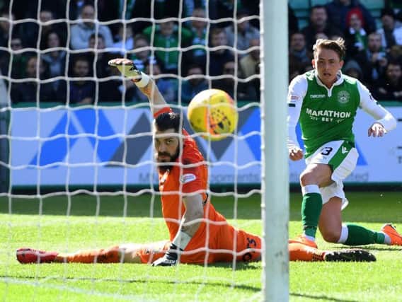 Scott Allan steers the ball beyond Kilmarnock goalkeeper Leo Fasan to give Hibs a 29th minutes lead at Easter Road