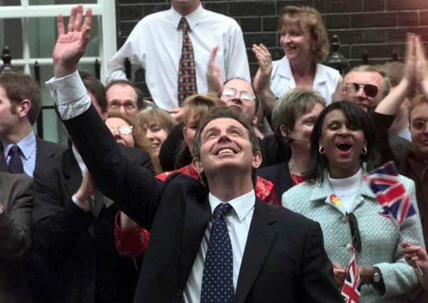 Tony Blair waves to wellwishers in  Downing Street following his election victory in 1997. Picture: AP