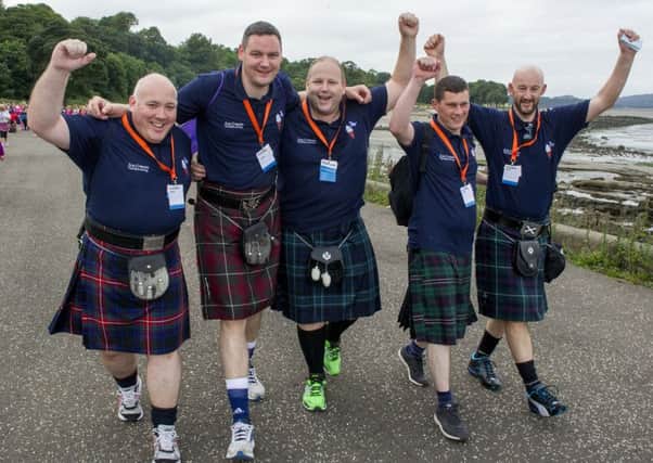 Kiltwalkers celebrate as they stride along. Picture: Ian Rutherford