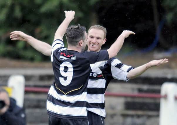 Blair Batchelor is congratulated for scoring against Camelon
