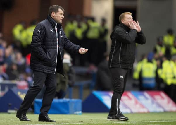 Graeme Murty, with Neil Lennon in the background, leave Rangers earlier this week. Picture: SNS