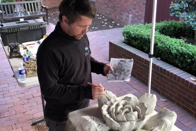 The Scottish white rose being carved on the White House lawn.