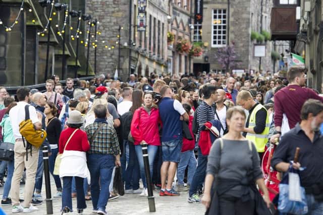 Many argue that Edinburgh is becoming too busy during the tourist season.