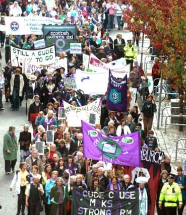 Thousands parade from Bruntsfield Links to Calton Hill to mark the centenary of the Suffragettes Edinburgh march demanding the right to vote in 1909.