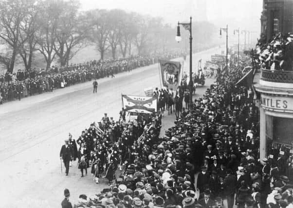 Thousands of women are to march along Princes Street to celebrate the centenary of the right to vote. Picture: The 1909 suffragettes march along Princes Street.
