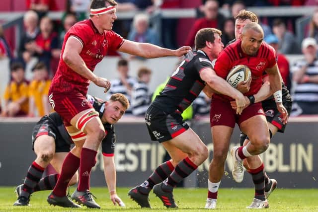 Edinburghs Mark Bennett gets to grips with Simon Zebo. Pic: Billy Strickland/REX