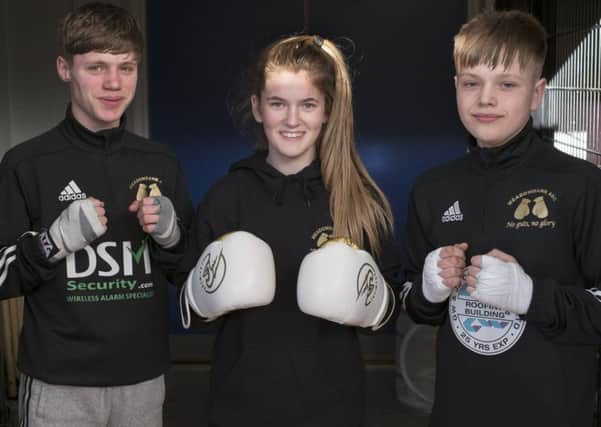 From left, Owen Paton, Nicole Stewart and Brad MacFarlane will fight at the British Junior Championships at Ravenscraig. Pic: Ian Rutherford
