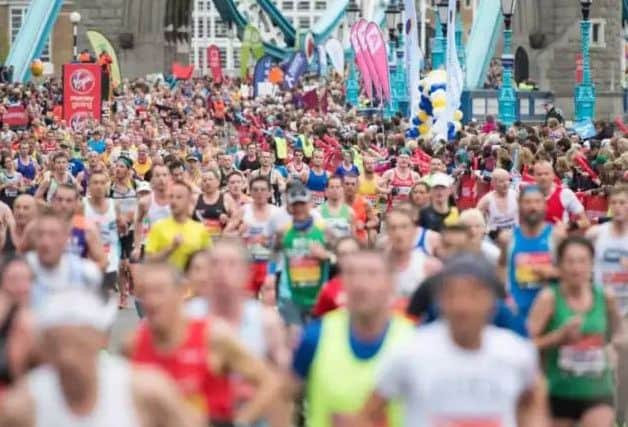 The runner claims he was cheated out of a medal after it was collected by a homeless man.