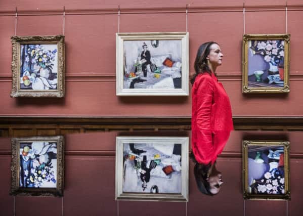 Lucy Brown of Sotheby's with Major Harrison's Colourist collection. Picture: John Devlin