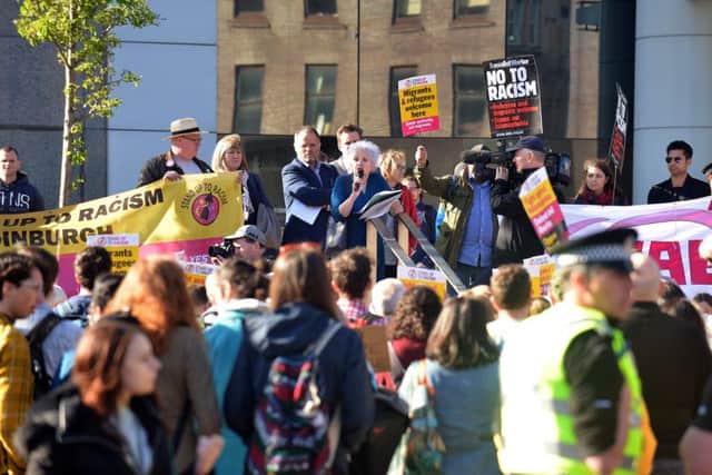 People gather for the Stand Up To Racism rally in Tollcross. Picture: JON SAVAGE