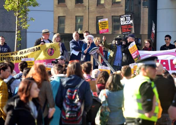 People gather for the Stand Up To Racism rally in Tollcross. Picture: JON SAVAGE