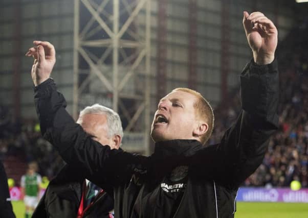 Hibs head coach Neil Lennon gestures to the Hearts fans at full-time
