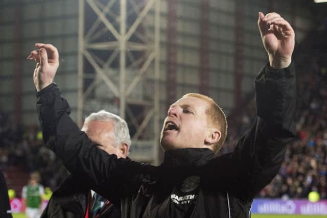 Hibs head coach Neil Lennon gestures to the Hearts fans at full-time