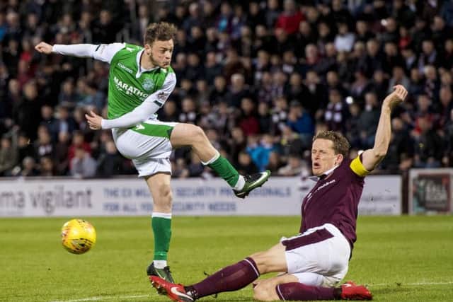 Brandon Barker sees a shot blocked by Hearts captain Christophe Berra. Picture: SNS Group