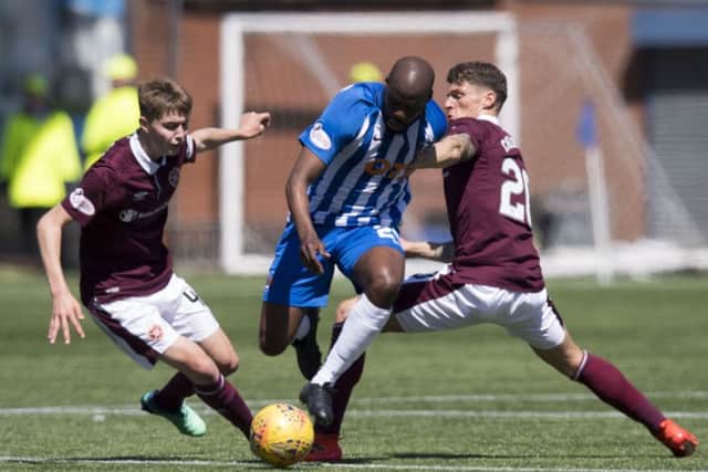 Hearts midfielders Harry Cochrane, left, and Ross Callachan battle with Kilmarnock's Youssouf Mulumbu