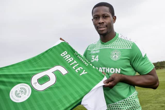 Marvin Bartley shows off the special commemorative logo the Hibs players will sport on the back of their shirts against Rangers to mark the tenth anniversary of the Hibernian Community Foundation