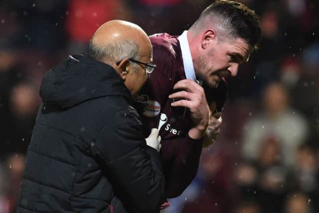 Kyle Lafferty suffered a shoulder injury during the derby