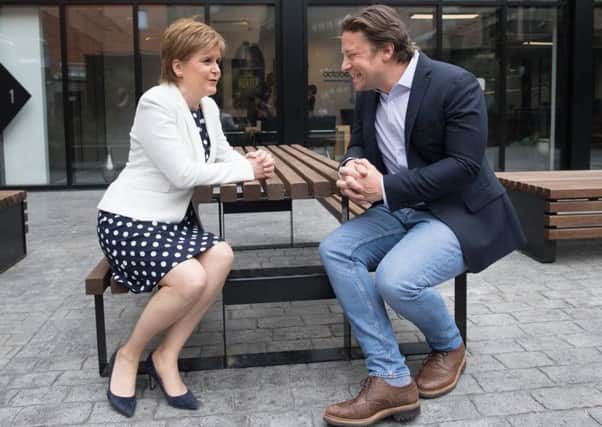 Jamie Oliver meeting First Minister Nicola Sturgeon. Picture: Stefan Rousseau/PA Wire