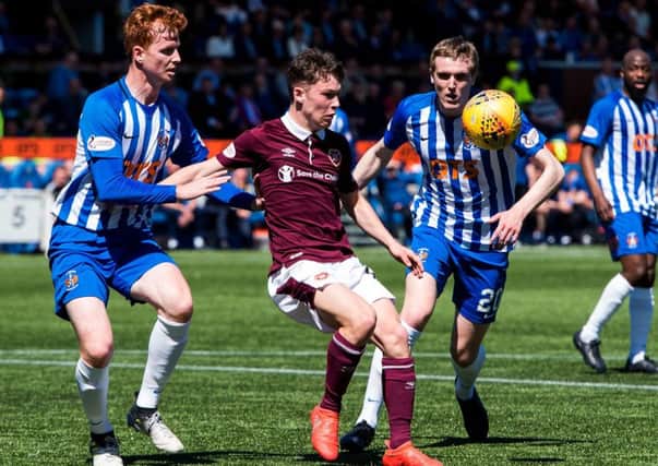 Hearts' Anthony McDonald competes with Kilmarnock defender Scott Boyd