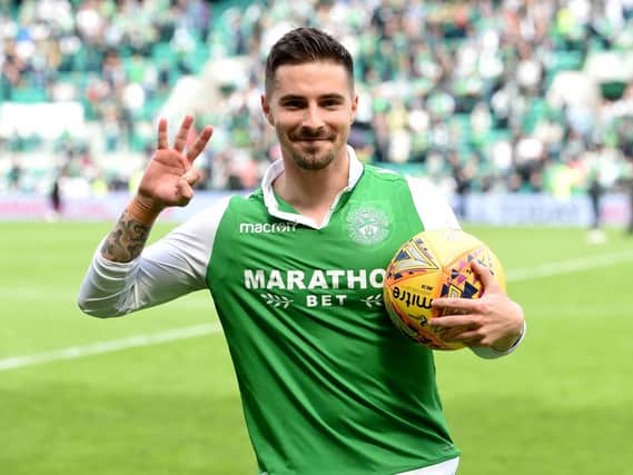 Jamie Maclaren celebrates with the match ball following his hat-trick against Rangers - but was it enough to take him to the World Cup?