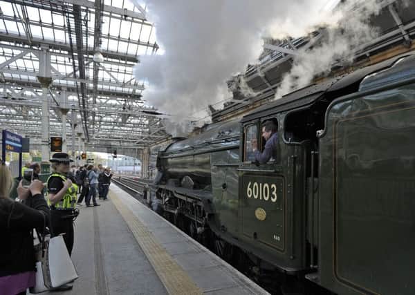 Thousands of steam enthusiasts celebrate the Flying Scotsman's return to Scotland