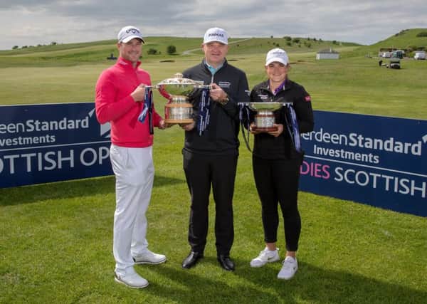 Marc Warren, Paul Lawrie and Michele Thomson with the Scottish Open trophies at Gullane. Pic: Kenny Smith