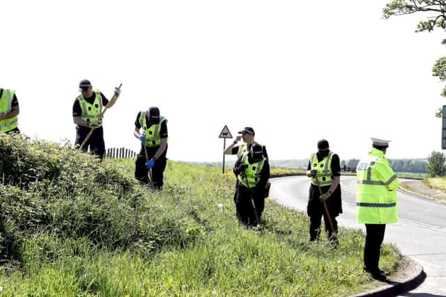 Police search the scene of where a recent fatal accident happened. Picture: Lisa Ferguson