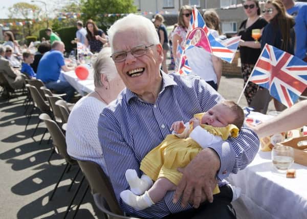 Royal wedding street party in Buckstone Road - the oldest and youngest residents, 79 year old Leslie Hannaford with 5 week old Ella O'Donnell