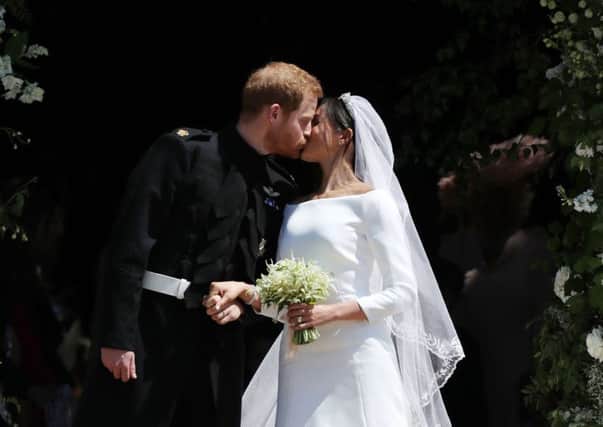 Prince Harry, Duke of Sussex and The Duchess of Sussex kiss as they leave St George's Chapel, Windsor Castle after their wedding ceremony Picture: Jane Barlow - WPA Pool/Getty Images