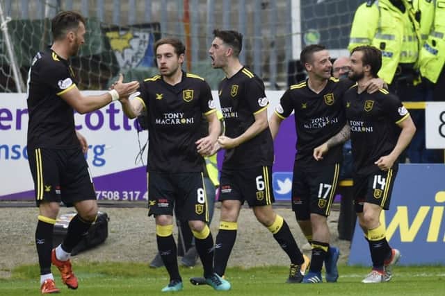 Livingston celebrate Keaghan Jacobs' (No.14) winner. Pic: SNS
