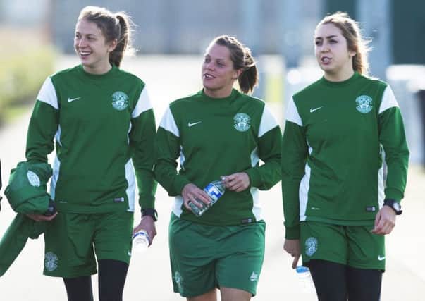 Lizzie Arnot, left, with Lisa Robertson and Clare Williamson scored five goals in the cup final for Hibs