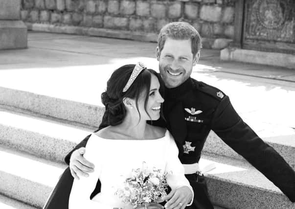 A picture of Prince Harry and Meghan Markle looking happy on the East Terrace of Windsor Castle. Picture: Alexi Lubomirski/Kensington Palace via AP