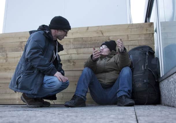 Homeless outreach worker Nick Harrold talking with homeless Craig Murdison