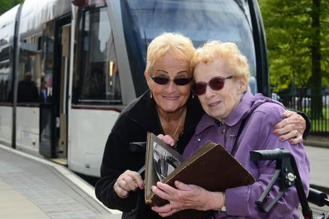 Valdis and Kristina took a trip on the new tram network. Picture: Jon Savage