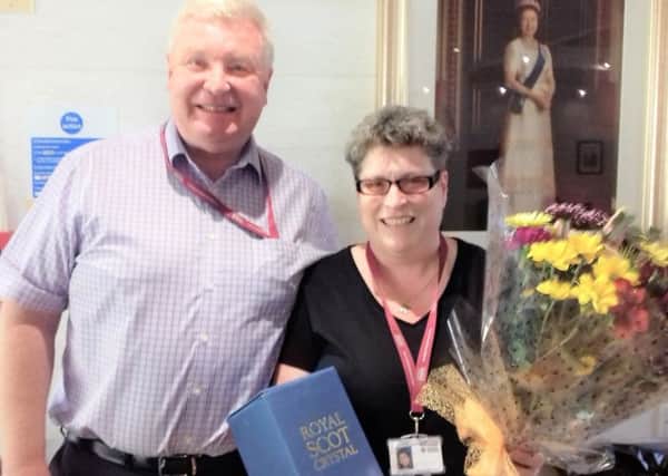Annette Miller celebrates her 30 years of service with Scottish Veterans Residences CEO Phil Cox