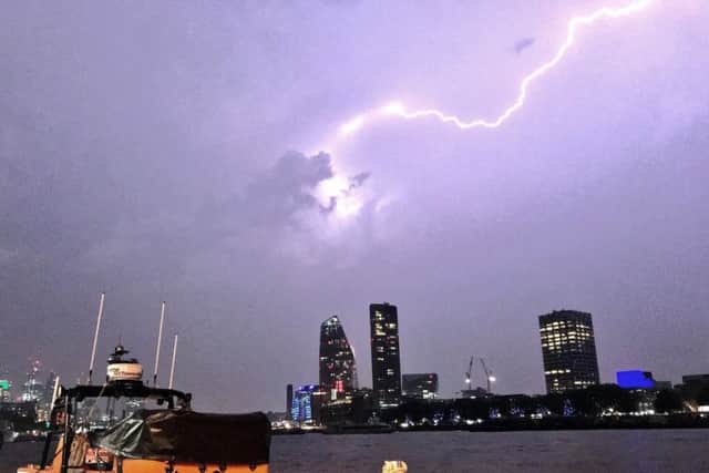 This photo made available by RNLI, shows a lightning strike during a storm in London, Saturday May 27, 2018. (Matt Leat/RNLI via AP)