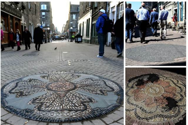 A number of Rose Street's eight rose mosaics have been covered in tarmac. Picture: TSPL
