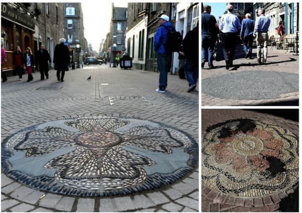 A number of Rose Street's eight rose mosaics have been covered in tarmac. Picture: TSPL
