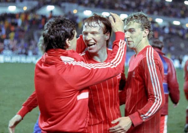 Alex McLeish (centre) celebrates the European Cup Winners' Cup Final win with Eric Black (left) and Neale Cooper (right). Picture: SNS Group