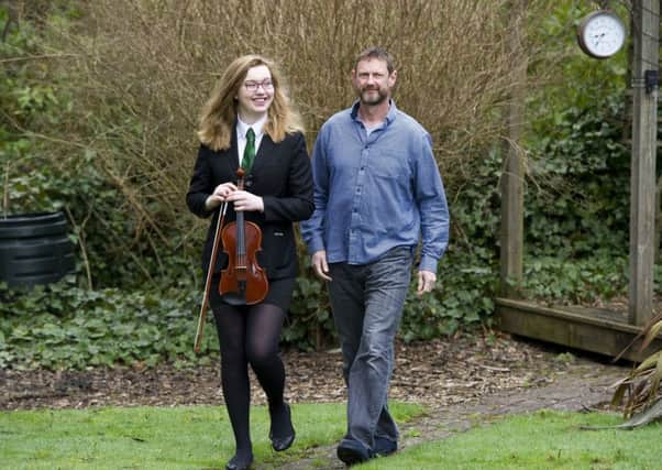 Dave Gornall and his daughter Abby are among those affected by music tuition changes introduced by West Lothian Council