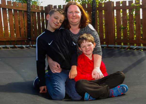 Lisa Hamlett with her twin sons Dylan (in navy) and Ewan (in red), aged 9. Ewan has been diagnosed with a rare condition MED 12 Deletion and has the abilities of a 3/4 year old. He has been attending Saltersgate School in Dalkeith but Lisa is upset that Saltersgate School have told her he will have to attent a mainstream school against her wishes. Pic taken 04/06/18