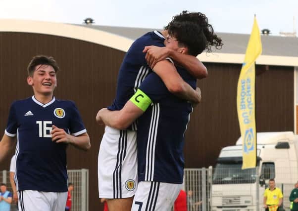 Scotland skipper Oliver Burke is congratulated on his goal. PIc: TGSPhoto/REX/Shutterstock