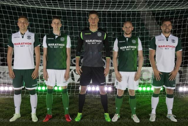 From left, Ryan Porteous, Oli Shaw, Kevin Dabrowski, David Gray and Darren McGregor model the new Hibs kits for the 2018/19
season. Pic: Hibernian FC